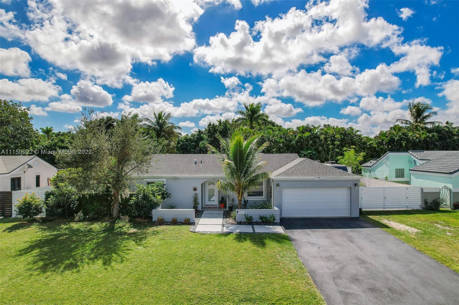 15534 Southwest 153rd Street Miami, FL 33187 - Photo 39 of 44 a view of a house with swimming pool and sitting area