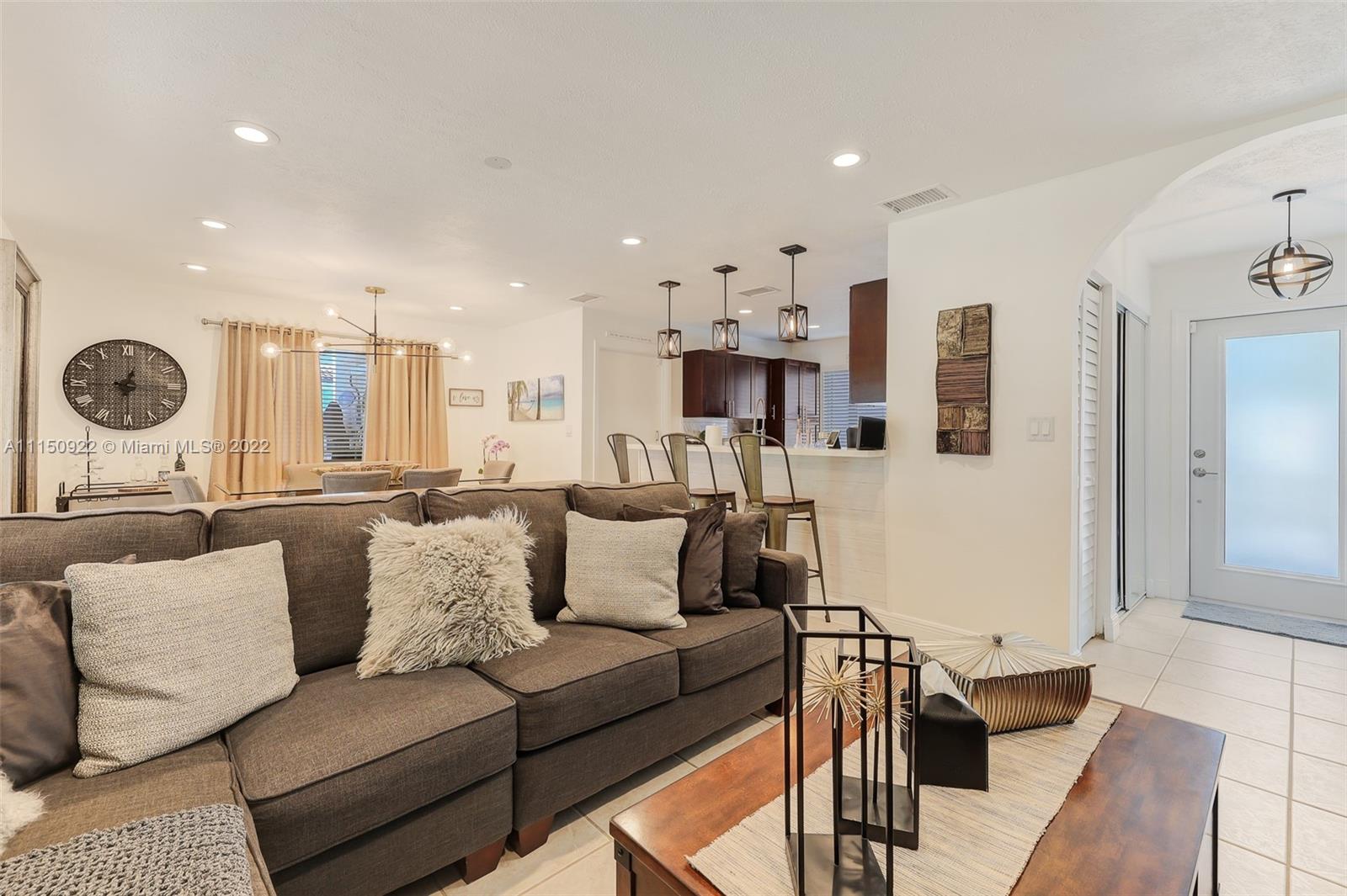 15534 Southwest 153rd Street Miami, FL 33187 - Photo 9 of 44 a living room with furniture and a large window