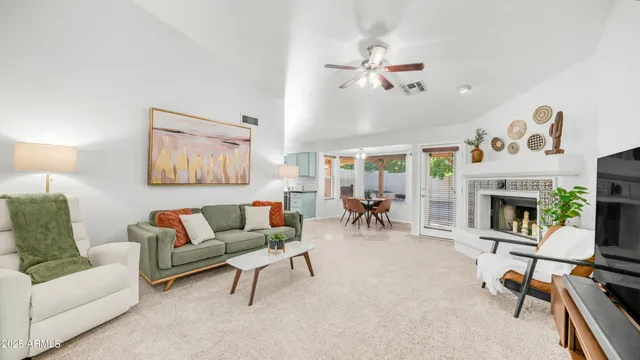 a spacious bathroom with a double vanity sink a toilet a mirror and