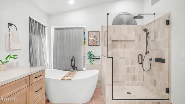 a bedroom with bed and a potted plant