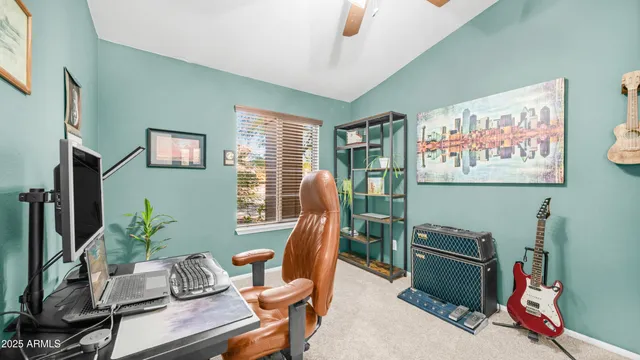 a view of a porch with chairs and floor to ceiling window