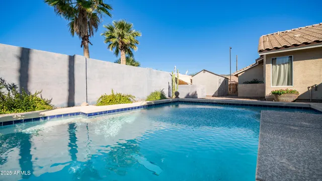 an aerial view of residential house and green space