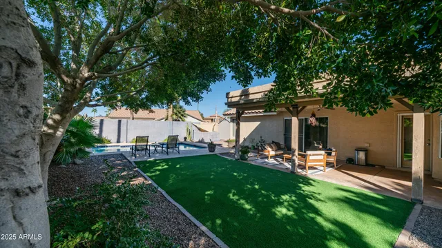 an aerial view of residential houses with city view