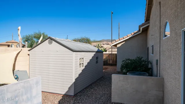a view of a lake with a house in the background