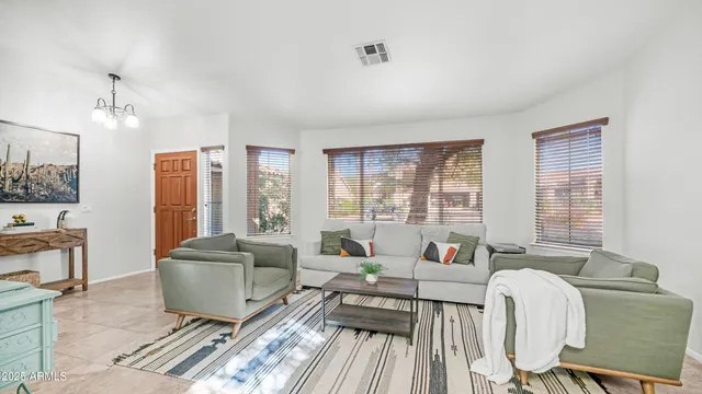 a kitchen with stainless steel appliances granite countertop a stove microwave and sink