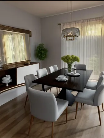 a view of a dining room with furniture and chandelier
