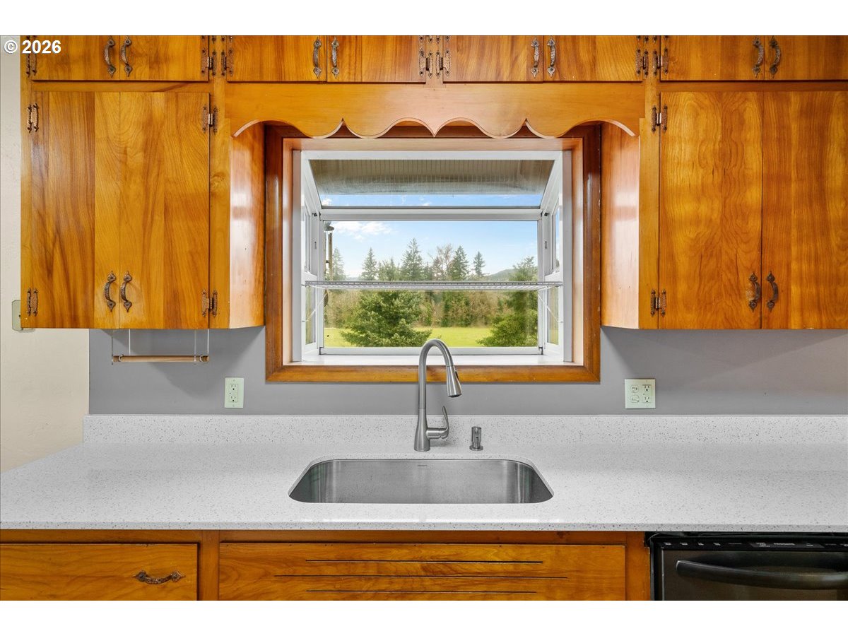 1611 Main Street Lyons, OR 97358 - Photo 14 of 48 a kitchen with a sink and a wooden cabinets