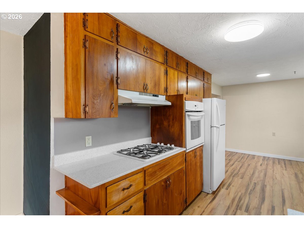 1611 Main Street Lyons, OR 97358 - Photo 16 of 48 a kitchen that has a cabinets and a stove