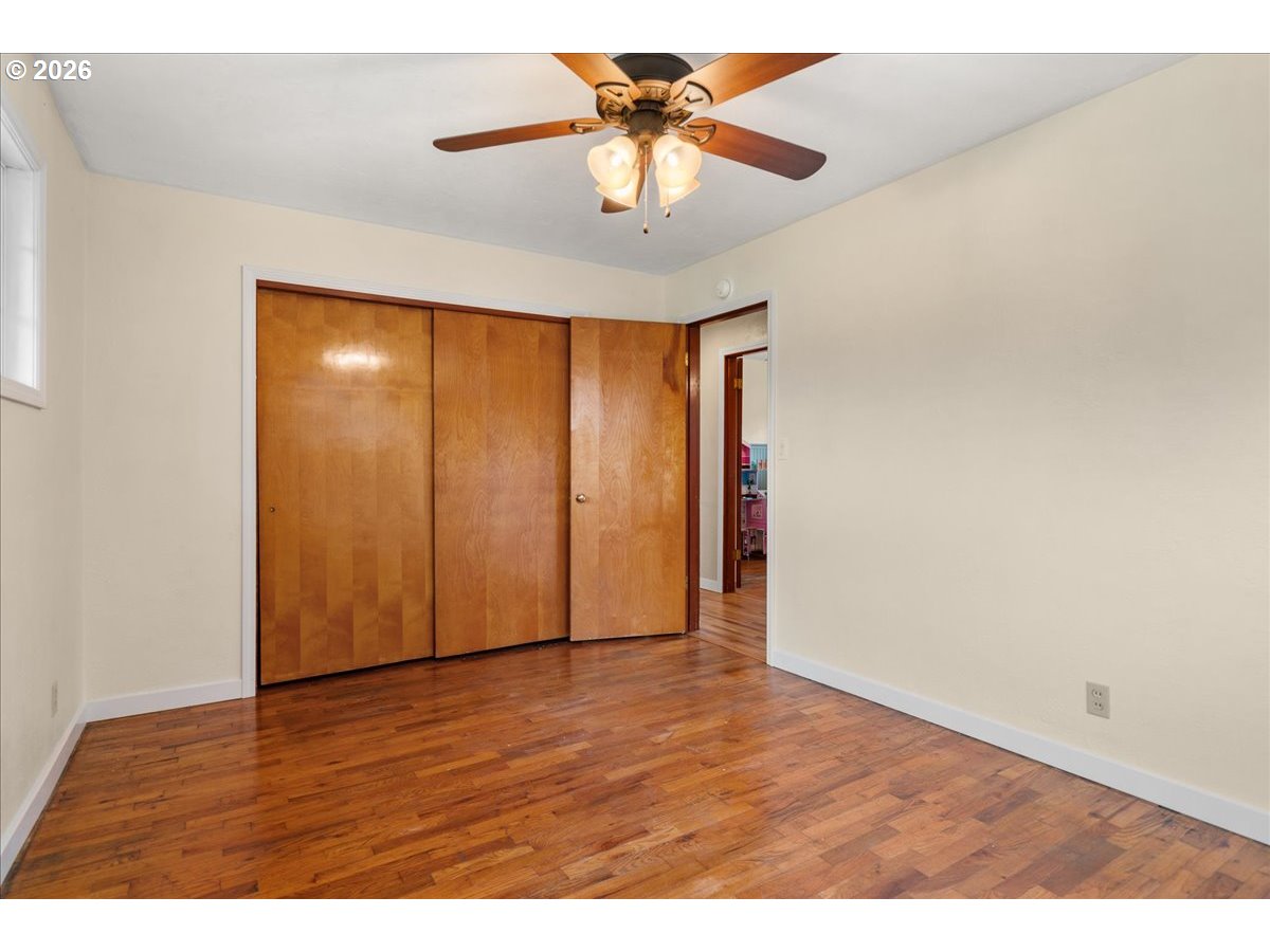 1611 Main Street Lyons, OR 97358 - Photo 24 of 48 a view of an empty room with a window and a chandelier