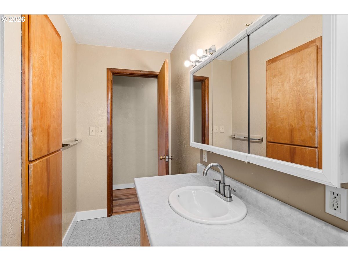 1611 Main Street Lyons, OR 97358 - Photo 27 of 48 a bathroom with a sink a mirror and a window