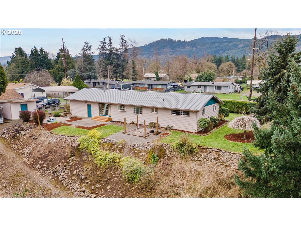 1611 Main Street Lyons, OR 97358 - Photo 40 of 48 a aerial view of a house with a garden and a yard