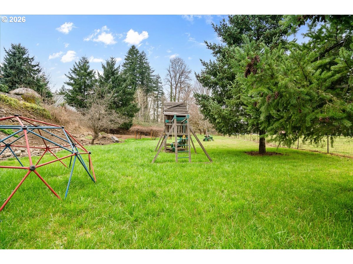 1611 Main Street Lyons, OR 97358 - Photo 45 of 48 a view of a playground with a plants and trees