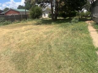 206 South White Street Floydada, TX 79235 - Photo 13 of 16 a backyard of a house with lots of green space