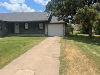 206 South White Street Floydada, TX 79235 - Photo 15 of 16 a front view of a house with garden