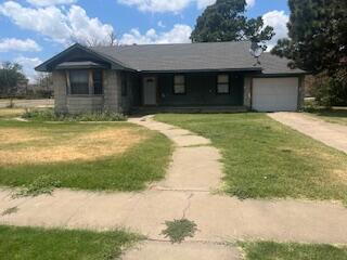 206 South White Street Floydada, TX 79235 - Photo 16 of 16 a front view of a house with a yard