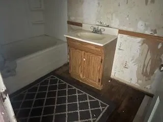 a bathroom with a sink and a mirror