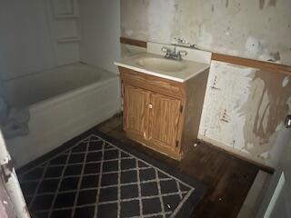 206 South White Street Floydada, TX 79235 - Photo 7 of 16 a bathroom with a sink and a mirror