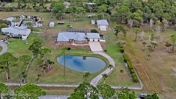 an aerial view of a house with outdoor space