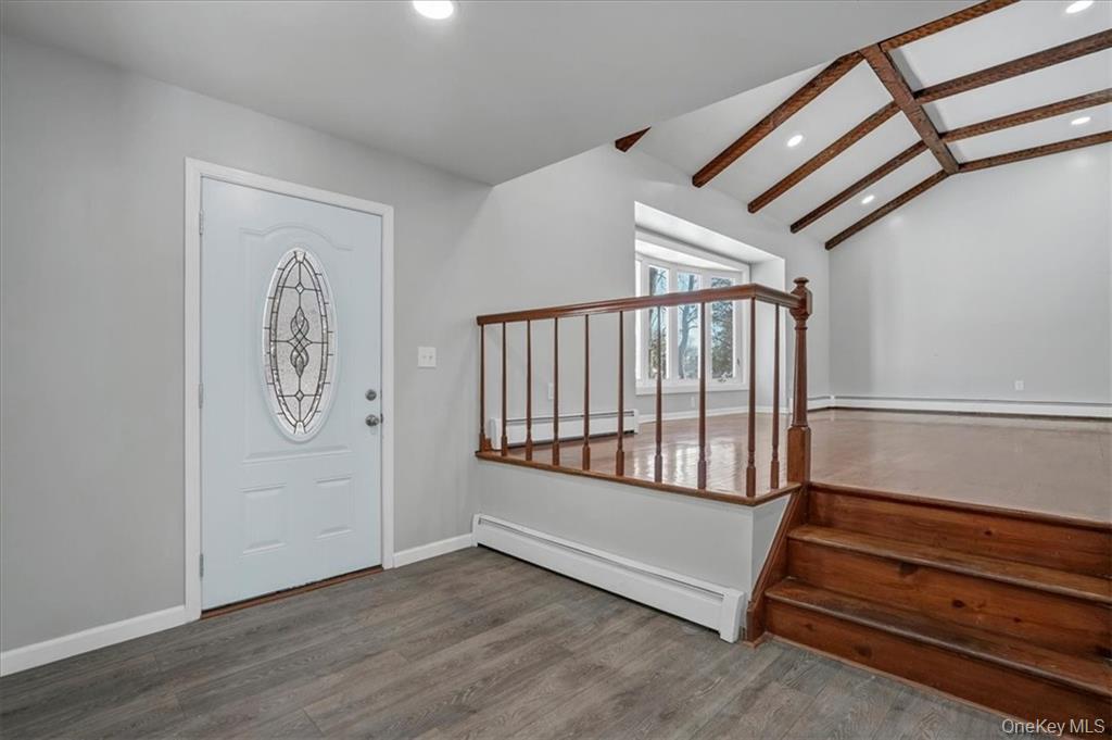 36 Ironworks Road Monroe, NY 10950 - Photo 7 of 37 Entrance foyer featuring a baseboard heating unit, wood finished floors, stairs, and recessed lighting