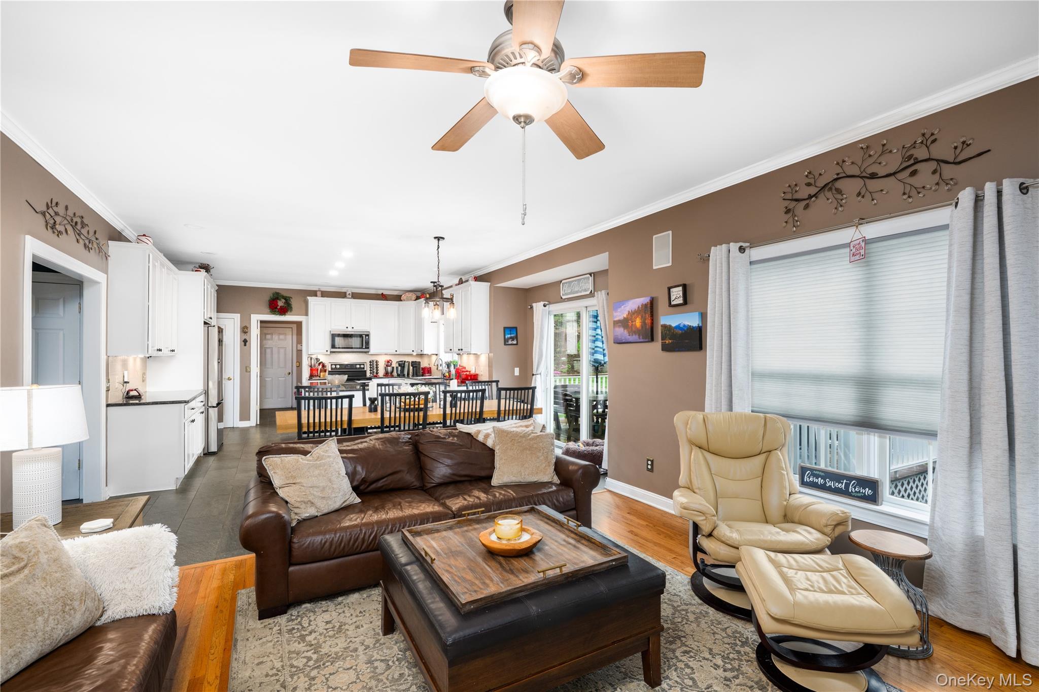60 Idlewild Road Marlboro, NY 12542 - Photo 14 of 37 Open-concept living area with wood-finish flooring, crown molding, a ceiling fan, and recessed lighting