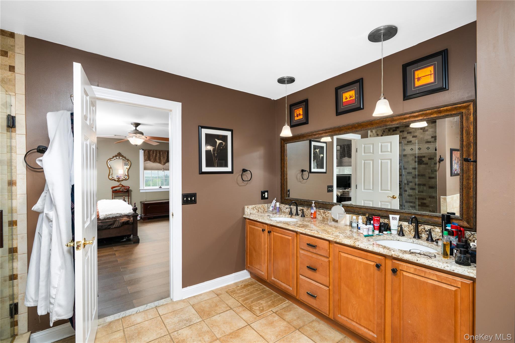 60 Idlewild Road Marlboro, NY 12542 - Photo 21 of 37 Bathroom featuring a double vanity with granite countertops, dual undermount sinks, and bronze-finish faucets