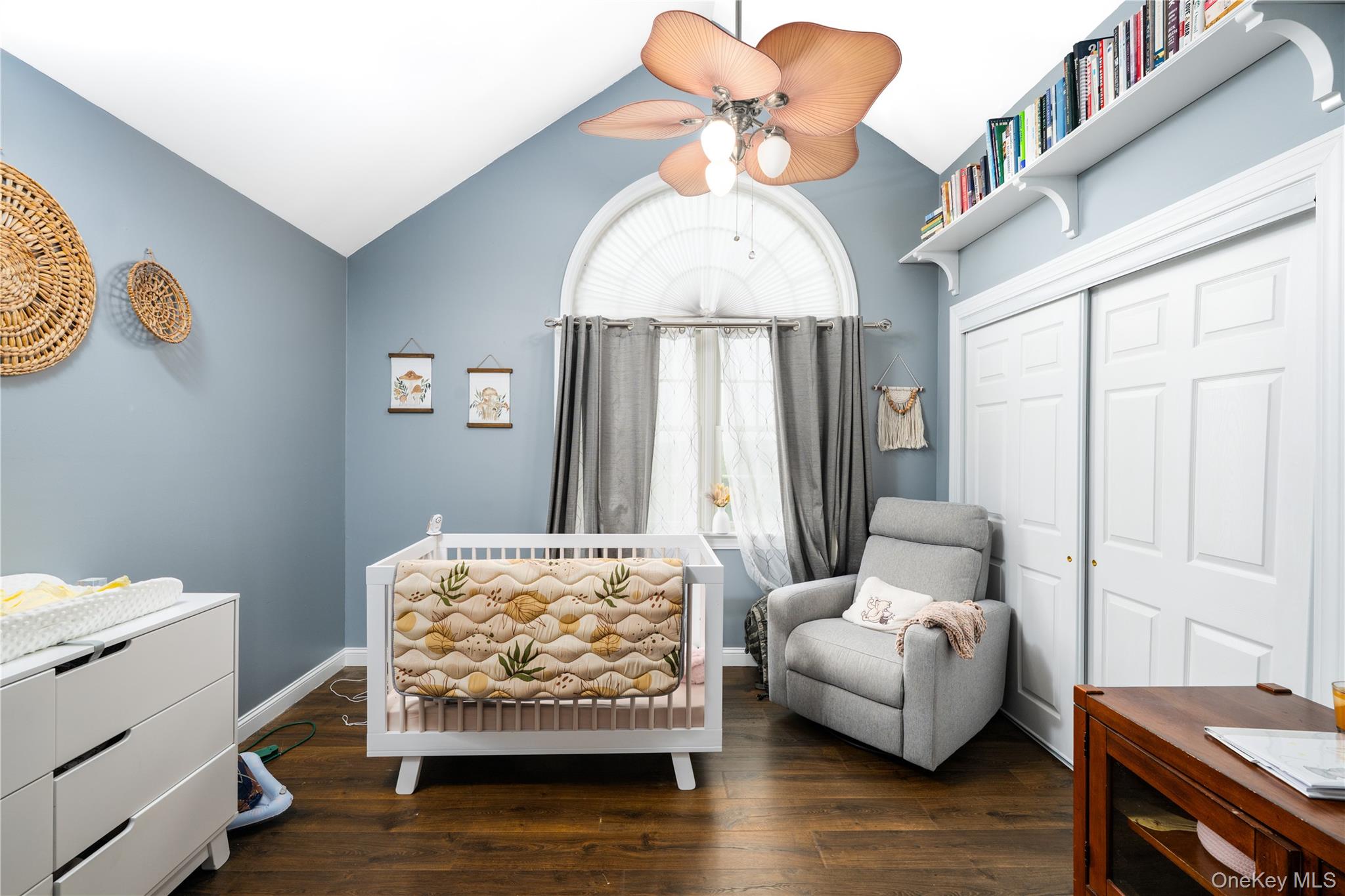 60 Idlewild Road Marlboro, NY 12542 - Photo 22 of 37 Vaulted ceiling room featuring wood-finish flooring and an arched window with drapes