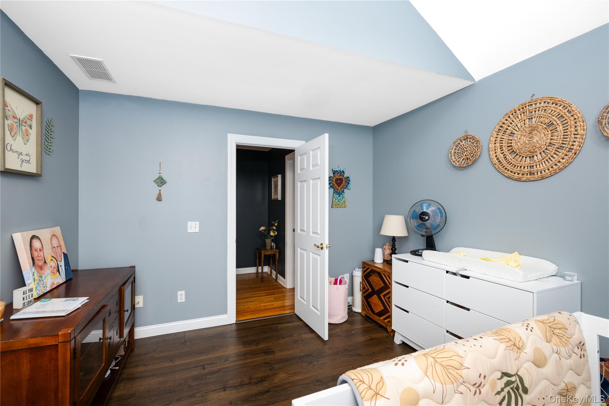 60 Idlewild Road Marlboro, NY 12542 - Photo 23 of 37 Room featuring vaulted ceiling, dark wood-finish flooring, and a white interior door