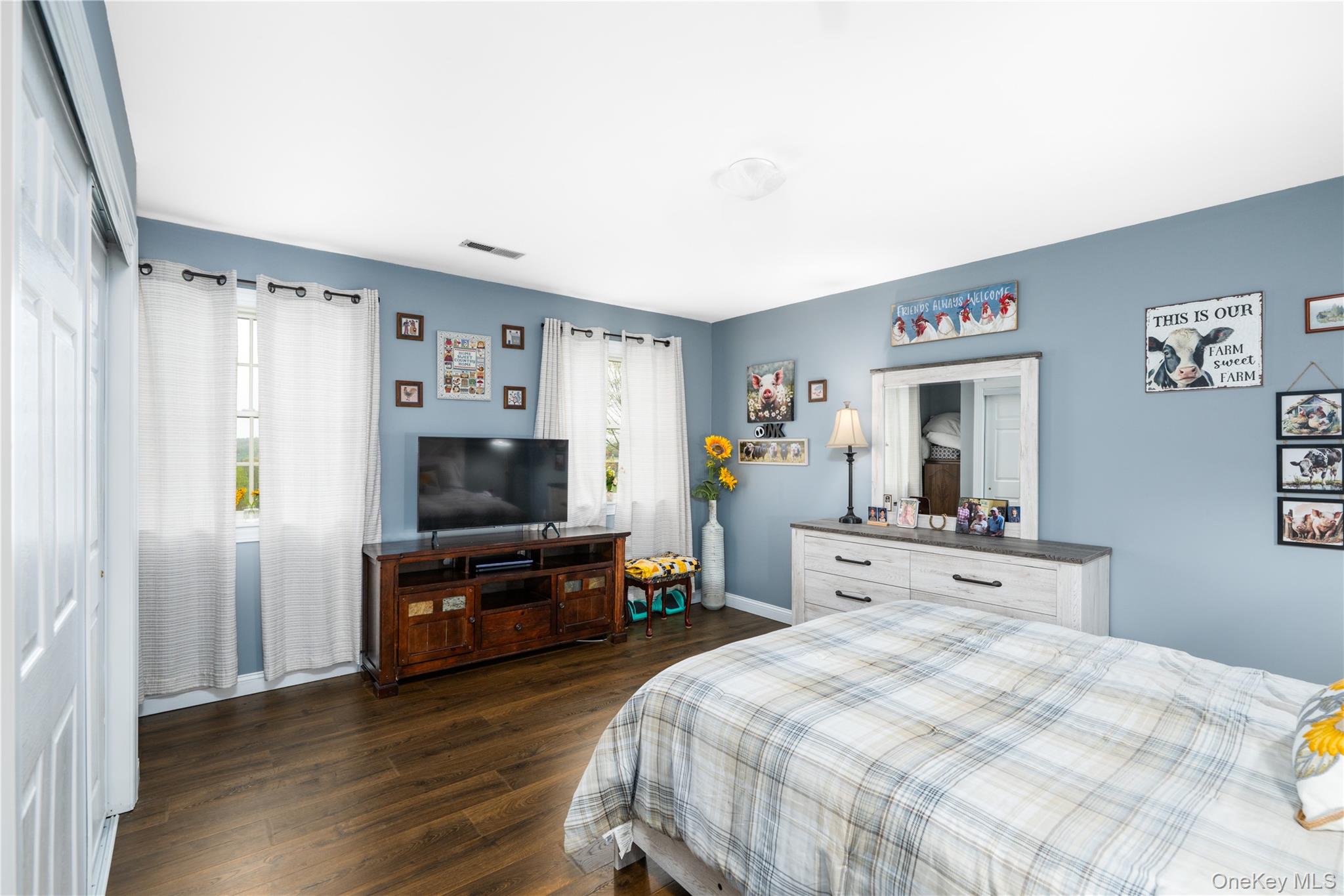 60 Idlewild Road Marlboro, NY 12542 - Photo 24 of 37 Spacious room featuring wood-finish flooring, light blue walls, and white trim