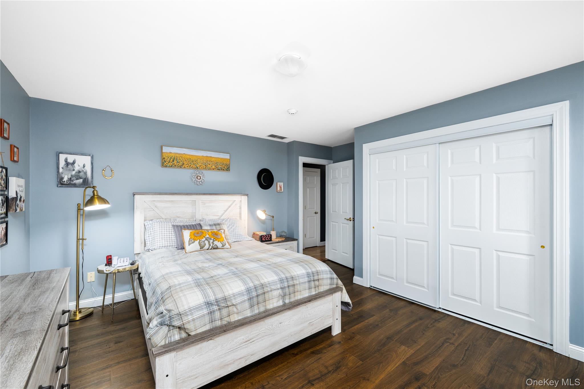 60 Idlewild Road Marlboro, NY 12542 - Photo 25 of 37 Spacious room featuring wood-finish flooring, light blue walls, and a white ceiling