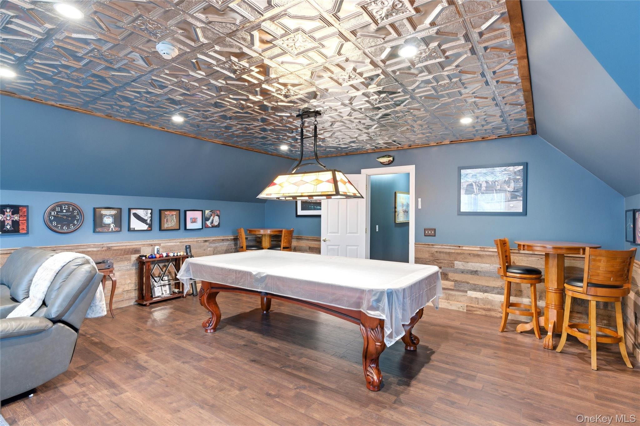 60 Idlewild Road Marlboro, NY 12542 - Photo 30 of 37 Recreation room featuring a decorative embossed tin-ceiling, rich wood-finish flooring, and shiplap wall accents