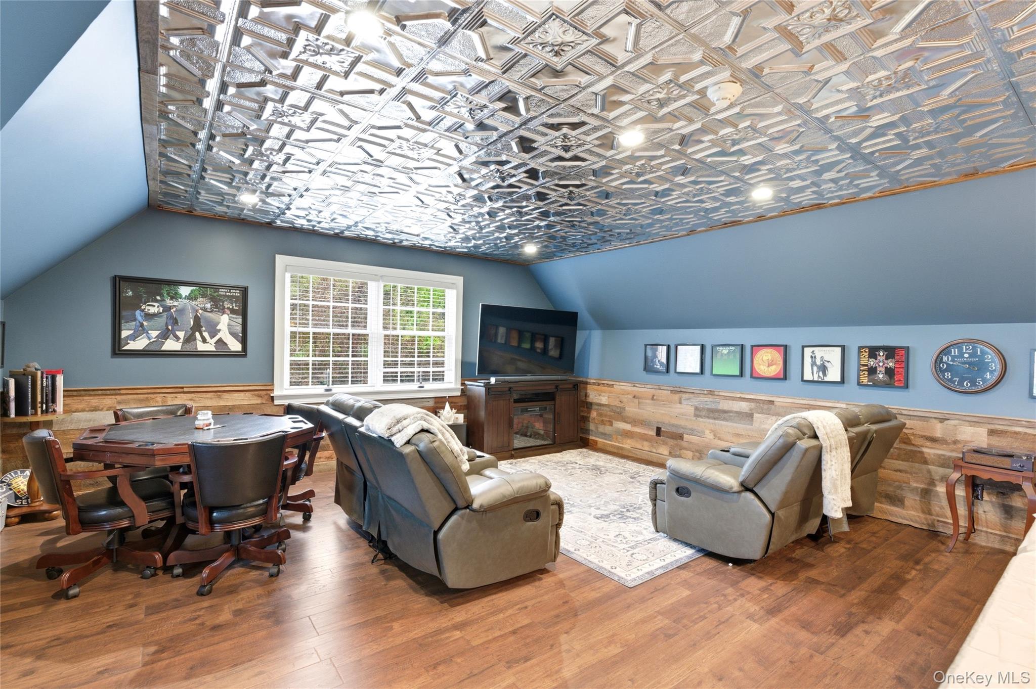 60 Idlewild Road Marlboro, NY 12542 - Photo 31 of 37 Recreation room featuring a distinctive tin ceiling with recessed lighting, wood-finish flooring, and shiplap wall accents