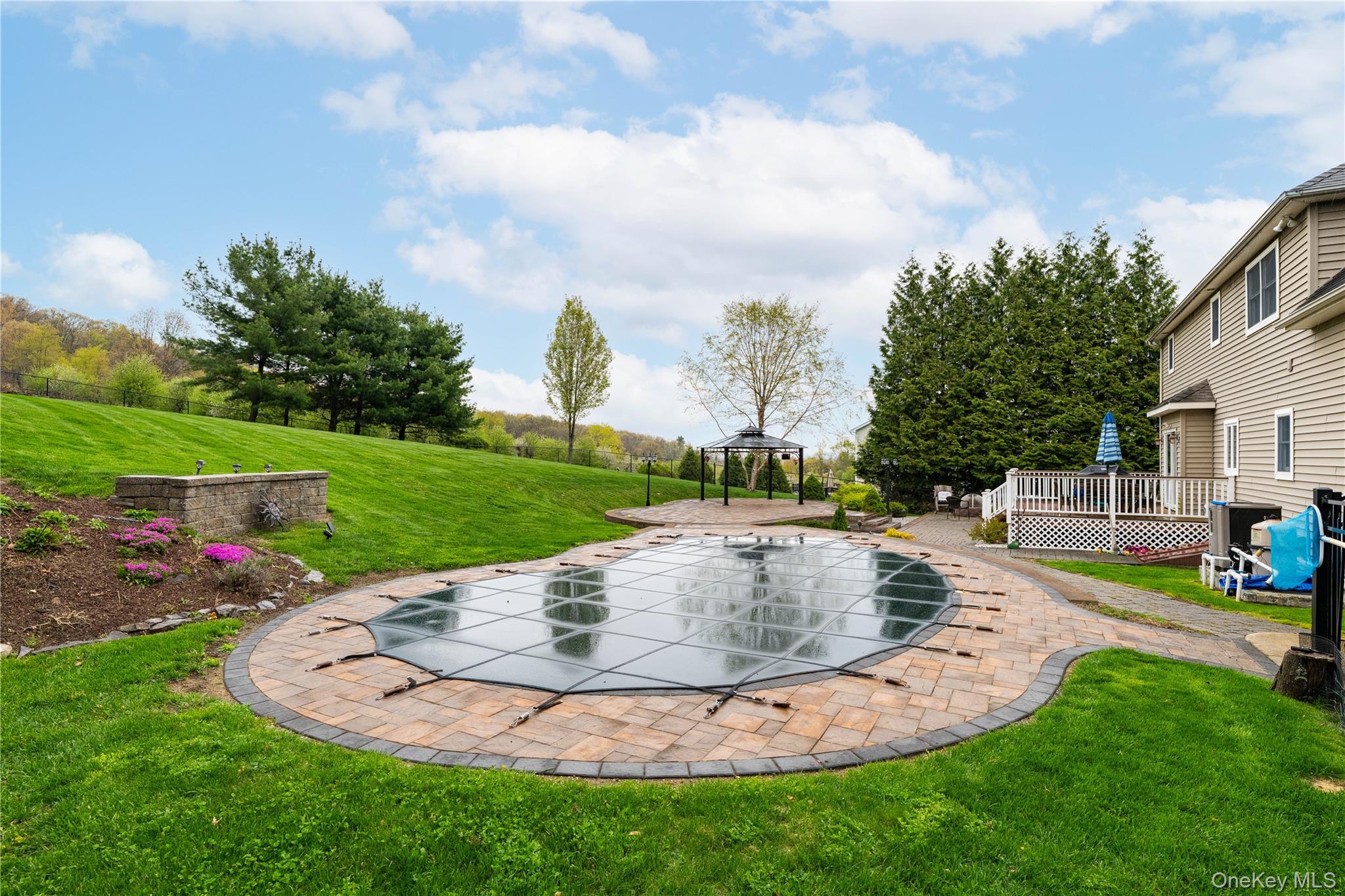 60 Idlewild Road Marlboro, NY 12542 - Photo 4 of 37 Expansive backyard featuring a covered heated-salt water pool with paver surround