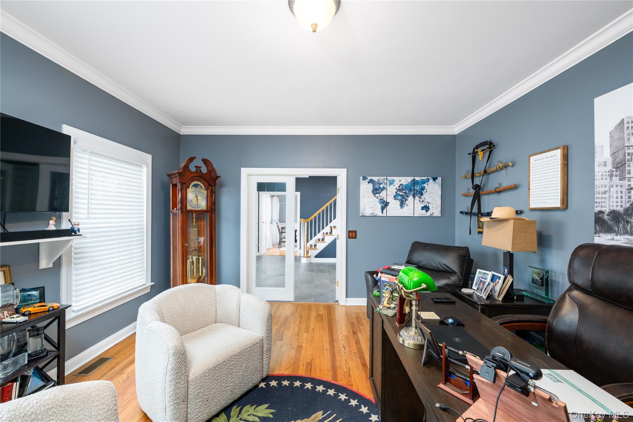 60 Idlewild Road Marlboro, NY 12542 - Photo 10 of 37 Hardwood flooring, crown molding, and neutral wall paint define this interior space
