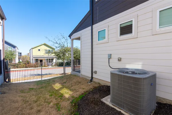a view of house with wooden deck and a sitting area
