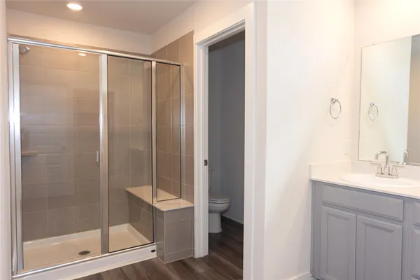 a bathroom with a shower and a sink