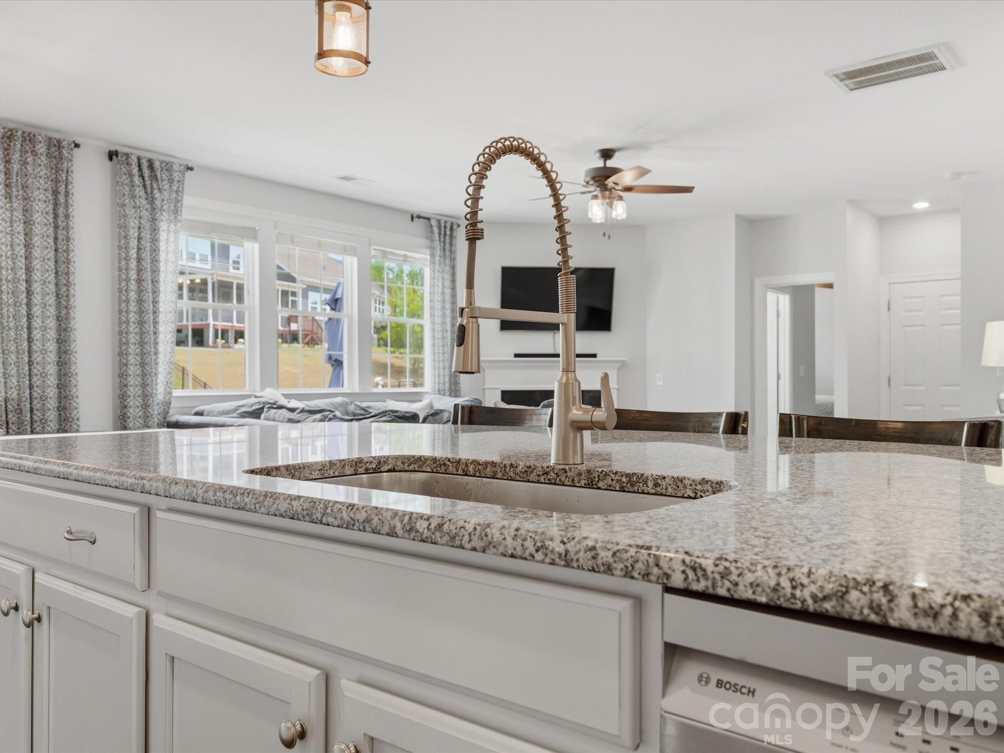 932 Twin Valley Way Fort Mill, SC 29715 - Photo 11 of 48 a kitchen with stainless steel appliances granite countertop a sink and a granite counter tops