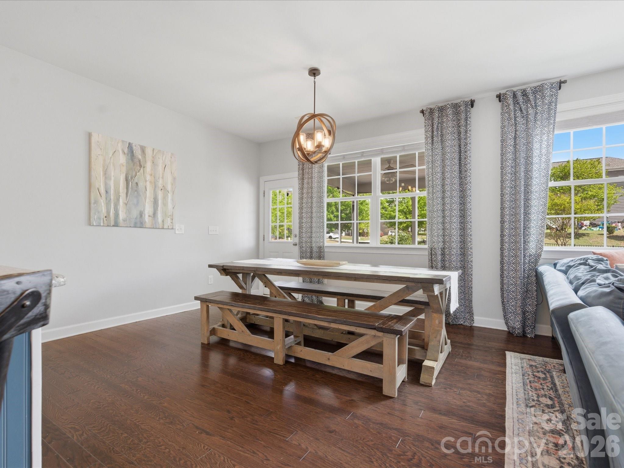 932 Twin Valley Way Fort Mill, SC 29715 - Photo 13 of 48 a living room with furniture a window and a chandelier