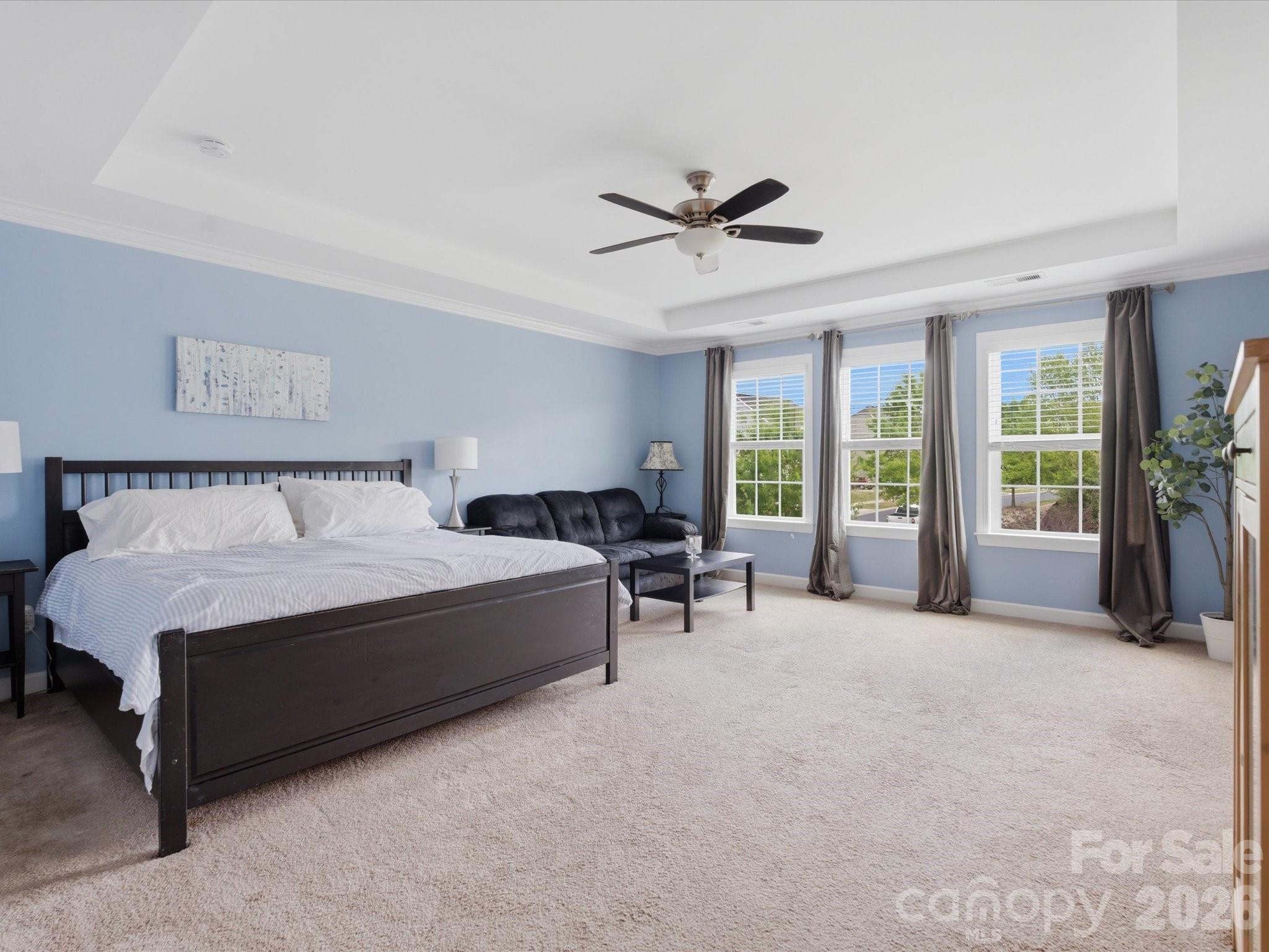 932 Twin Valley Way Fort Mill, SC 29715 - Photo 21 of 48 a spacious bedroom with a bed and a large window