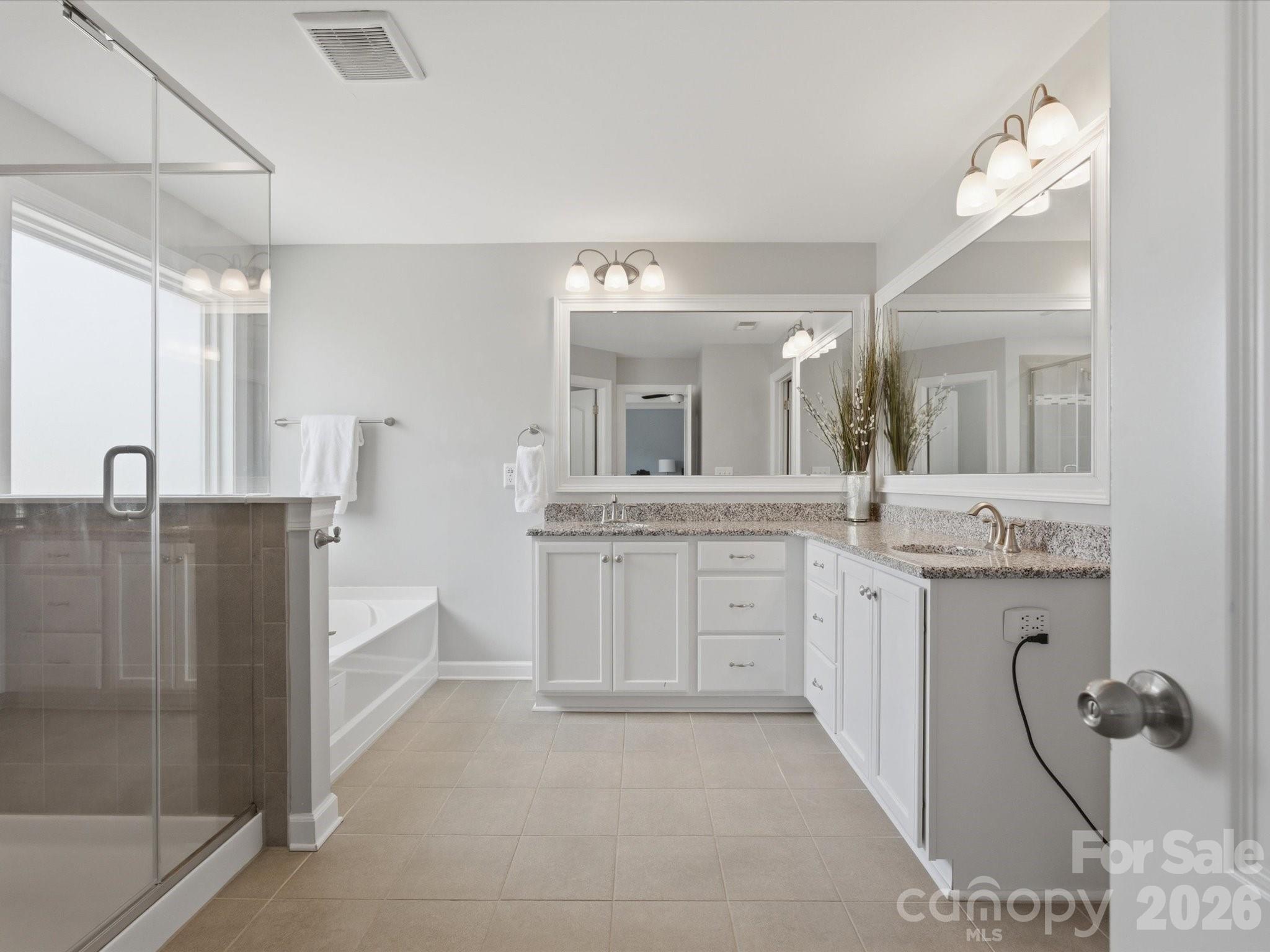 932 Twin Valley Way Fort Mill, SC 29715 - Photo 22 of 48 a bathroom with a granite countertop sink mirror and bathtub