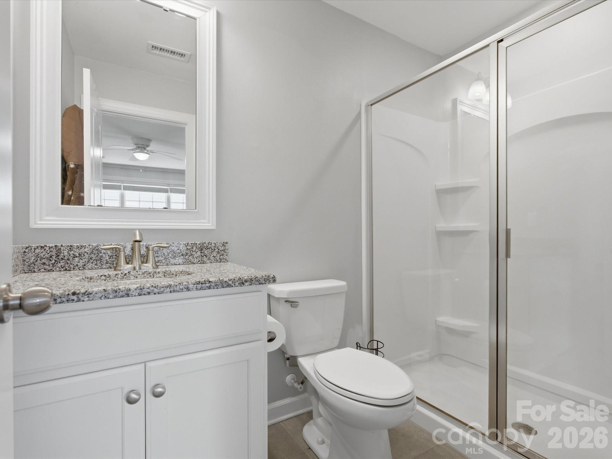 932 Twin Valley Way Fort Mill, SC 29715 - Photo 27 of 48 a bathroom with a granite countertop sink toilet and shower