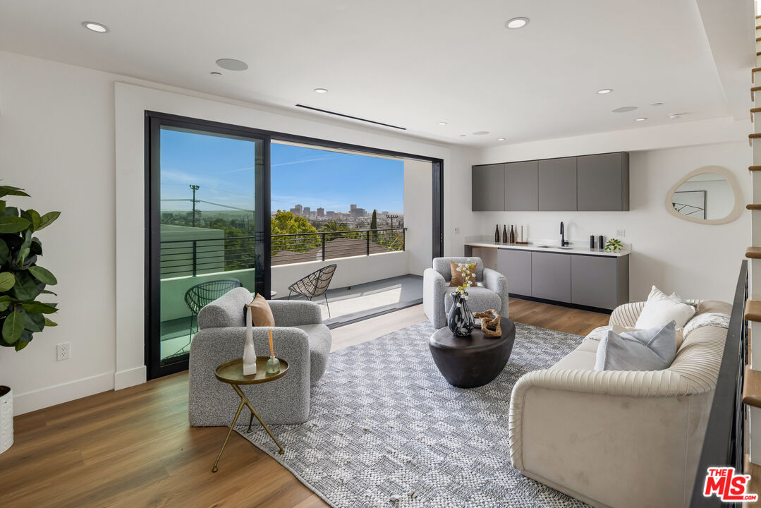 2003 Bellevue Avenue Los Angeles, CA 90026 - Photo 14 of 30 a living room with furniture and a potted plant