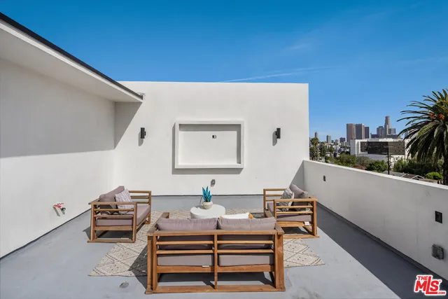 a room with furniture and a potted plant