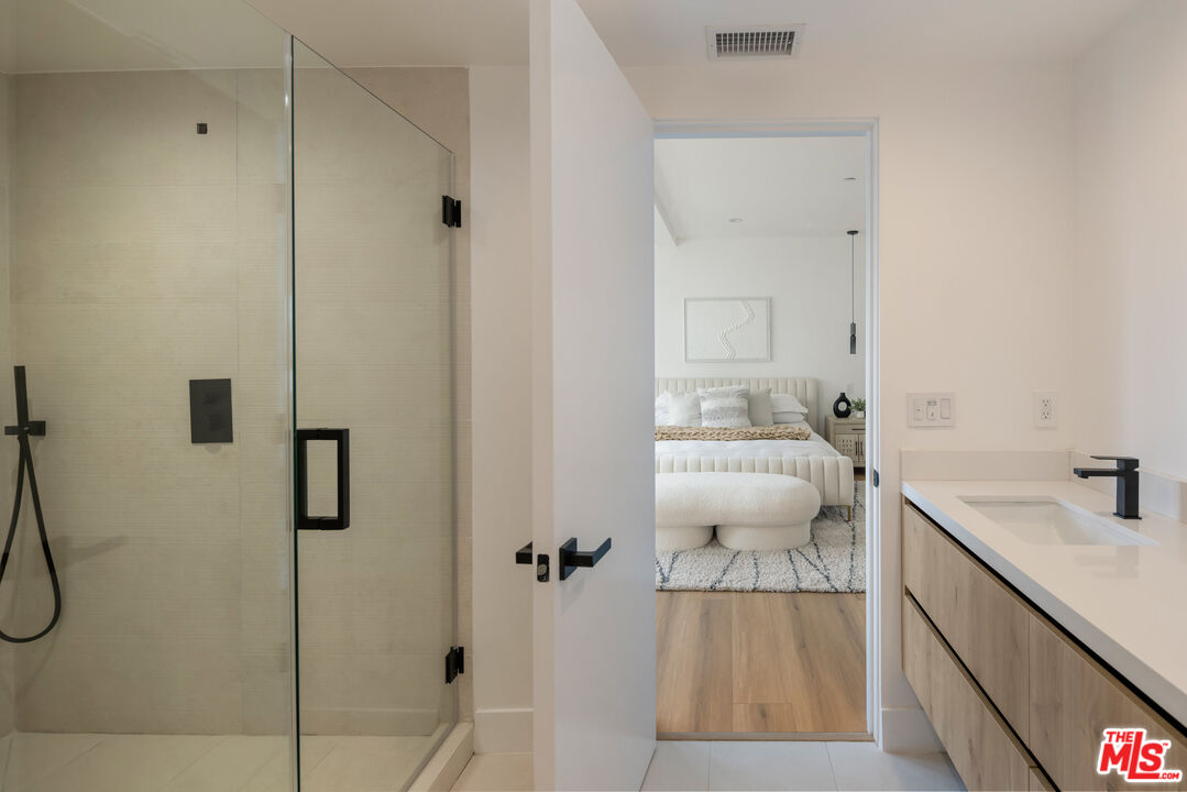 2003 Bellevue Avenue Los Angeles, CA 90026 - Photo 22 of 30 a bathroom with a sink and mirror