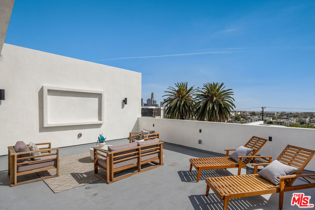 2003 Bellevue Avenue Los Angeles, CA 90026 - Photo 24 of 30 a living room with furniture and wooden floor