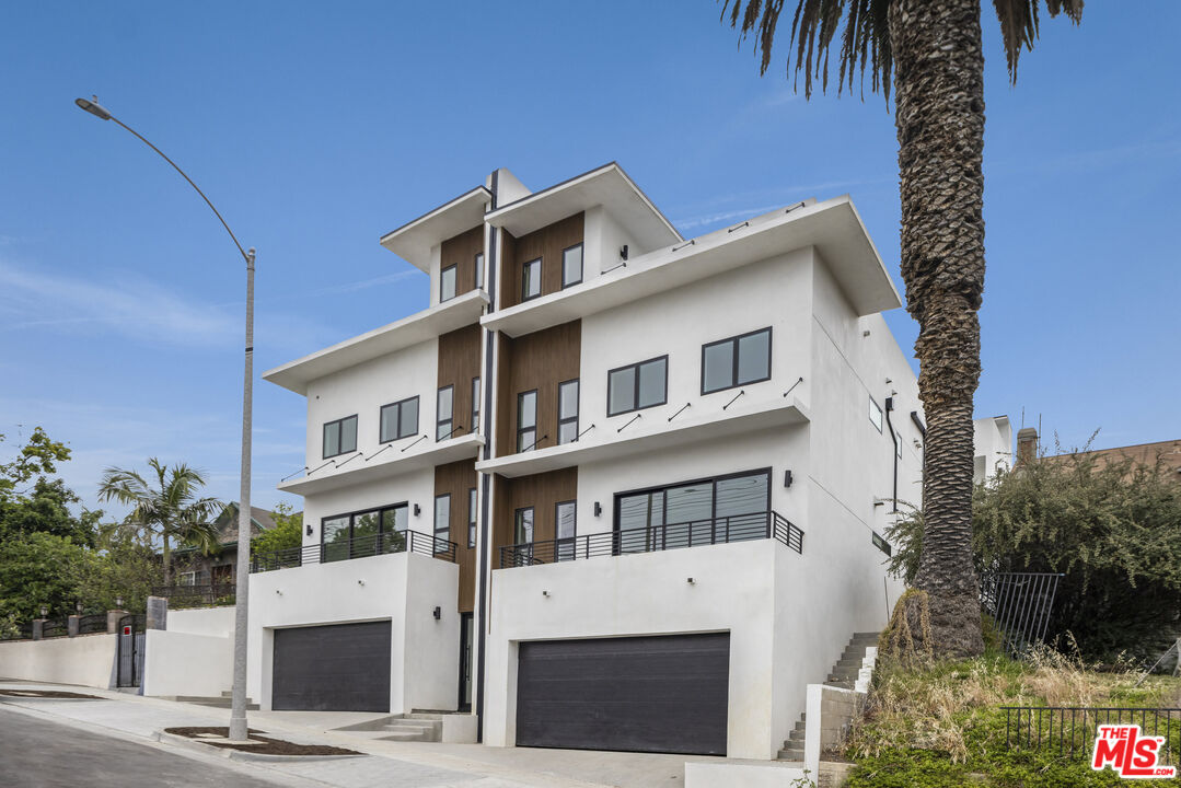 2003 Bellevue Avenue Los Angeles, CA 90026 - Photo 25 of 30 a front view of a building with a garden