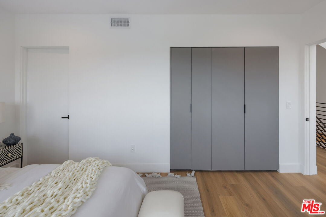 2003 Bellevue Avenue Los Angeles, CA 90026 - Photo 28 of 30 a bedroom with a bed and a dresser