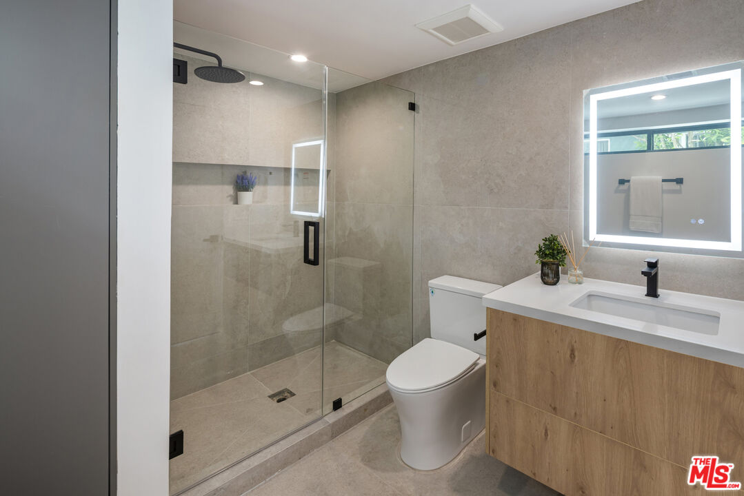 2003 Bellevue Avenue Los Angeles, CA 90026 - Photo 29 of 30 a bathroom with a sink a toilet and shower