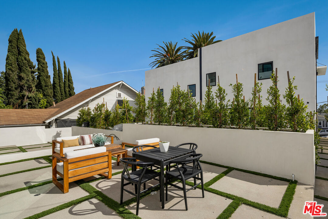 2003 Bellevue Avenue Los Angeles, CA 90026 - Photo 5 of 30 a backyard of a house with table and chairs
