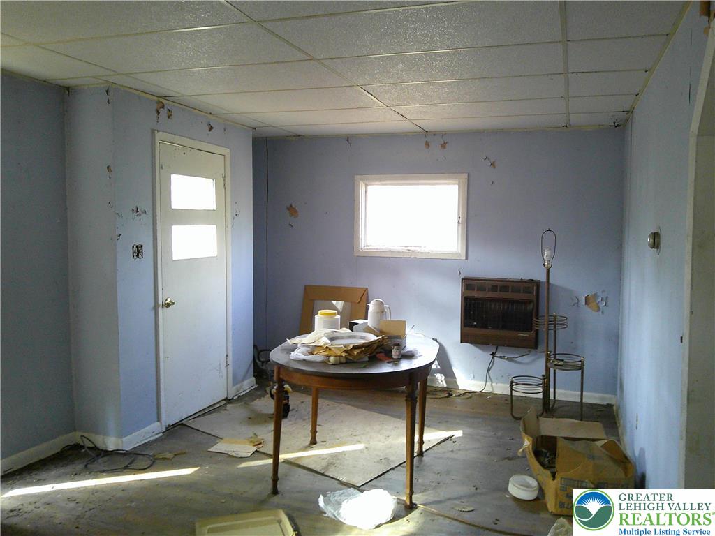 396 Turkey Ridge Road Mount Bethel, PA 18343 - Photo 4 of 9 a living room with furniture a flat screen tv and a window