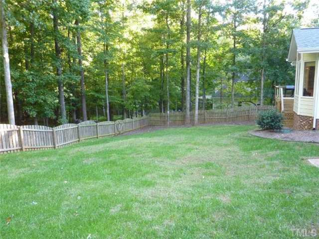 9420 Springdale Drive Raleigh, NC 27613 - Photo 22 of 25 Rear of Home, Large Landscaped Lot with Fence Exterior Back